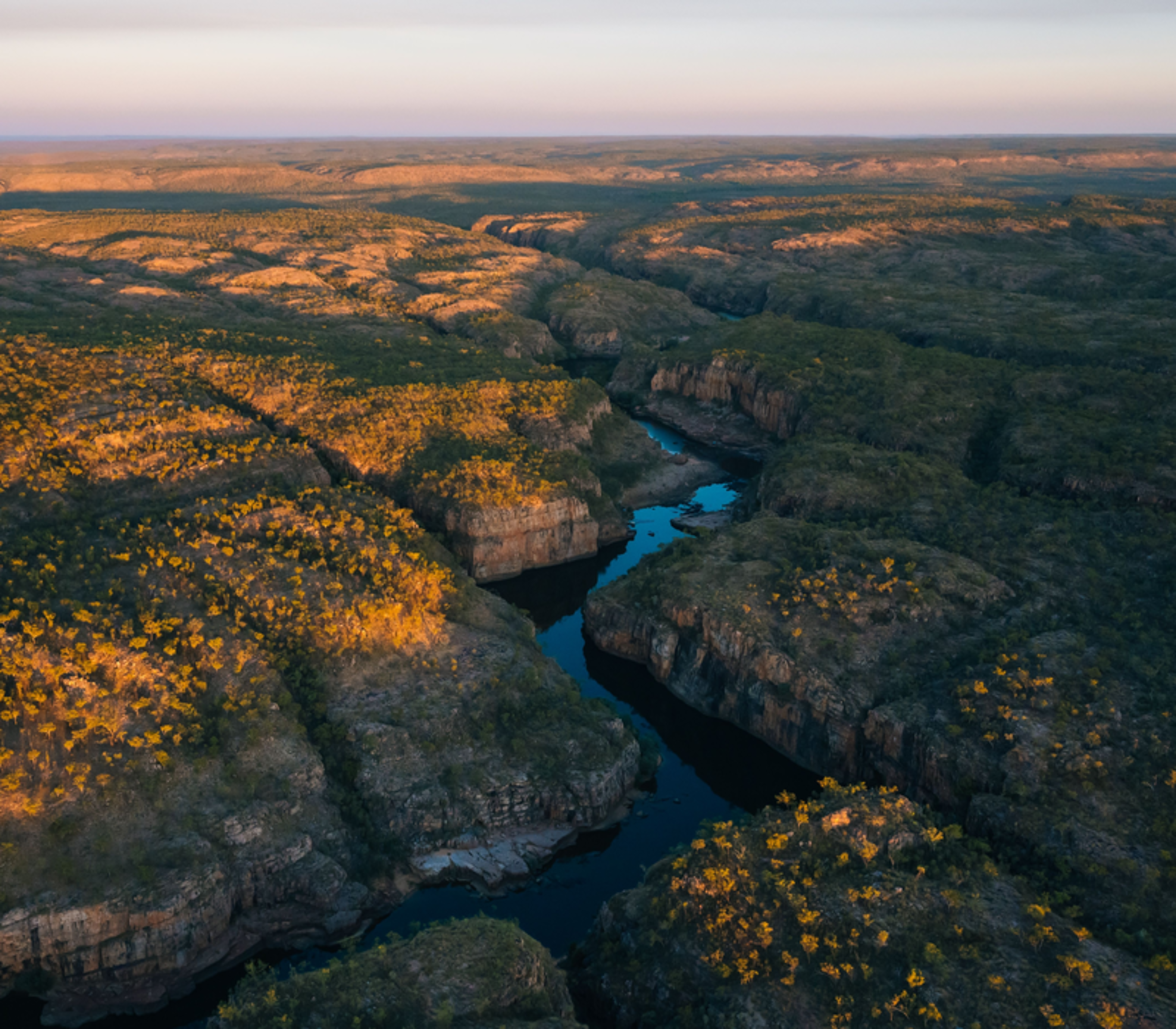 High-angle aerial view of the winding Katherine River through sandstone walls.