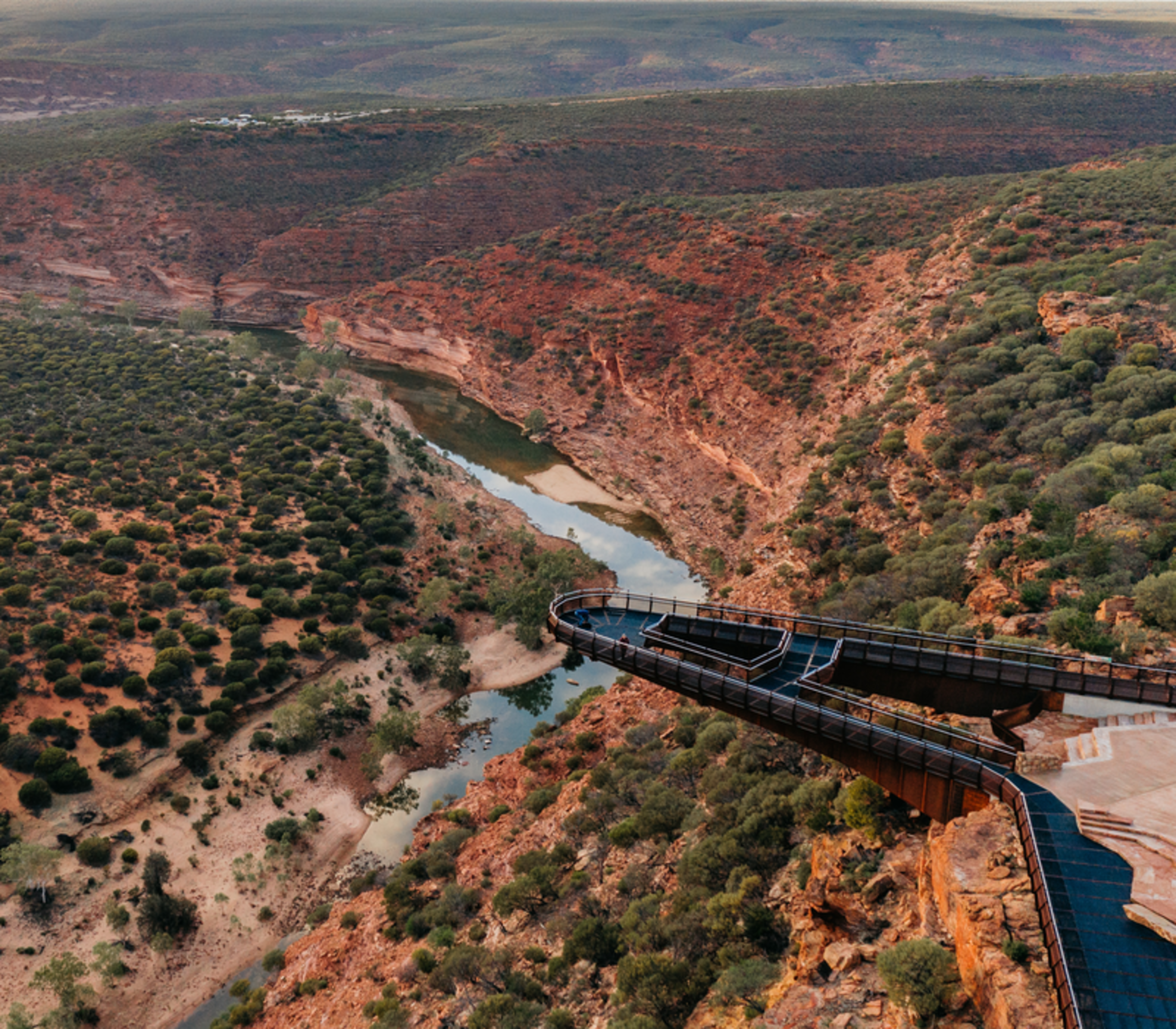 Kalbarri Skywalk (Kaju Yatka) during sunset, highlighting the architecture of the cantilevered platform against the Murchison River Gorge.